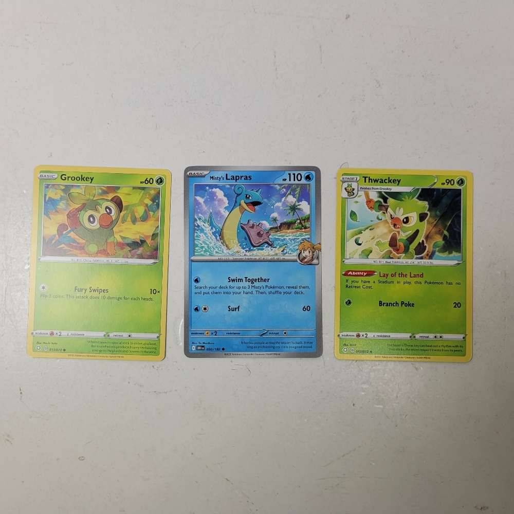 Grookey, Lapras, and Thwackey Pokémon Cards